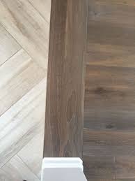 Interesting Way To Transition Flooring When The Plank Is Running In A Different Direction If The Herringbone I Flooring Herringbone Tile Vinyl Plank Flooring