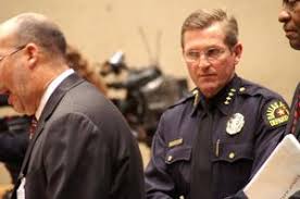 David Kunkle standing behind speaker]