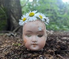 My family enjoys dump digging, and sifting old house sites. These doll  parts were found all