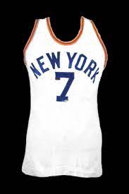 The black jersey has a subway token theme. New York Knicks Jersey History Jersey Museum