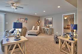 The Finished Basement Family Room Has 3 Separate Seating Areas The Door To The Right Leads To A Guest Bedroom Grey Family Rooms Game Room Basement Family Room