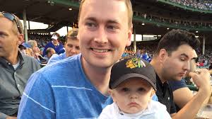 Chicago Cubs fan Keith Hartley robs Los Angeles Dodgers first baseman  Adrian Gonzalez of foul ball while holding 7-month-old son
