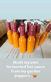 🔥 Straight from her garden - Carrie Underwood turned homegrown peppers into 12 bottles of homemade hot sauce. 🌶️ Talk about a kick! #CarrieUnderwood #HotSauce #CountryLife