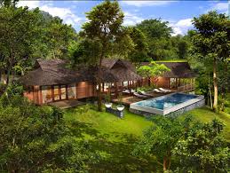 Tropical modern, as the style is called, combines the clean lines and muted color palette of contemporary design with the exotic woods and stone found in island homes. From Bali With Love Tropical House Plans From Bali With Love Tropical Houses Bali House Tropical House Design
