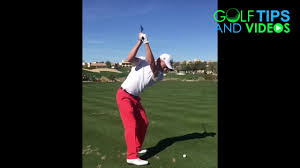 What you notice at the top of his backswing, below, is that his left shoulder is very much in behind the ball. Justin Thomas Iron Swing Down The Line Slow Motion Youtube