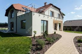 A modern suburban house in spring, poland. Modern Suburban House With Green Minimalist Garden Stock Photo Picture And Royalty Free Image Image 31479661