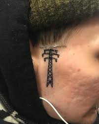 Image result for quirky pylon forehead tattoo