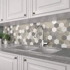 Tiled kitchen backsplashes give a custom look to a home and stand up better than a wallpapered backsplash according to an angie's list magazine report. Grand Terrace White Lace Back Splash Tile By Mohawk Menards Kitchen Sink Design Stone Mosaic Tile Hexagon Tile Wall