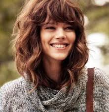 Find out how to wear the spring 2019 curly bangs trend here. Medium Length Haircuts With Bangs