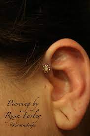 Scarification is a body modification that is slowly gaining more popularity, but it is not nearly as popular as tattoos. Pin By Braindrops On Magical Body Piercing Forward Helix Piercing Opal Jewelry Helix Piercing