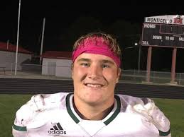 Beckman's Owen Huehnergarth runs over and through Monticello