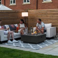 Featuring a stacked faux stone base and a natural granite tabletop, this unit makes for a great focal point to any patio area. Fireglow Albany Square Gas Firepit Coffee Table Wind Guard