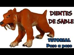 Una familia de tigres dientes de saber observa como una manada de mamuts woolly pasa por su guarida. Pin En Dinozavry