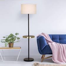 Floor lamp with 3 shelves for storage or display. 10 Floor Lamps With Tables Attached That Don T Look Like Your Grandma S Architectural Digest