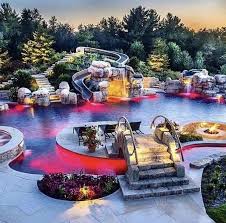 I Wouldn T Do Lights Like This But I Like The Idea Of A Meandering Pool Dream Backyard Lazy River Pool Backyard Pool