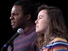 A white woman and a black man speak for each other to call attention to  privilege