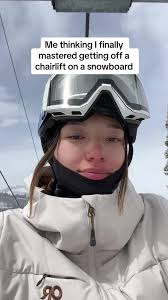 Snowboard Vs Skiiers Getting Off Chairlift
