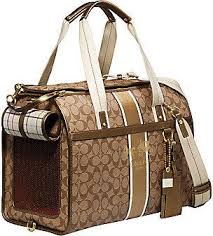 Pet carriers are small portable boxes, crates, or cages used to transport small animals such as cats, lap dogs, miniature pigs, ferrets, chickens, guinea pigs, and so on, from one location to another. Coach Heritage Stripe Dog Carrier Shopstyle Women S Fashion Dog Carrier Dog Bag Puppy Accessories