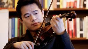 Violinist performs Bach at Leopold’s Books Bar Caffé in Madison