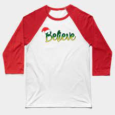 This Cute Christmas Tee Shirt Will Help You Ring In The Holidays This Year Features A Nice Cozy Santa Hat And The Word Believ Baseball Tshirts Shirts T Shirt