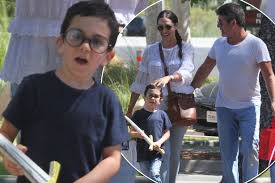 Asked if he could say his name, the toddler adorably replied: Simon Cowell S Young Son Eric Debuts Adorable Round Glasses And Looks Just Like His Famous Dad Mirror Online