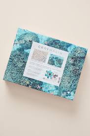 The hawaii beach double sided 500 piece puzzle features sunseekers basking on a sandy beach on one side and snorkelers exploring a stunning ocean reef on the other side. Gray Malin Double Sided Beach Puzzle Anthropologie