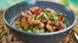 Place both the cauliflower and roasted vegetables in a large wok or wide pan with a lid. Radish Cucumber Tomato And Butter Bean Salad Vegetables