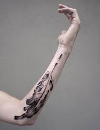 Minimalist Tattoos Mimic The Graceful Fluidity Of Brush Strokes Brush Stroke Tattoo Minimalist Tattoo Paintbrush Tattoo