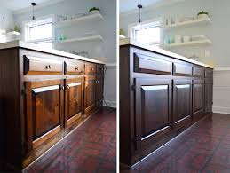 You can try a light sanding and then using one of the polyurethane and stain in one products which will darken the cabinets. Using Polyshades To Darken Our Wood Cabinets Young House Love