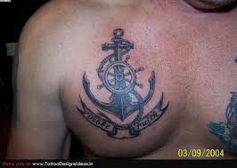 This is an interesting tattoo that effortlessly transfers from one body part to the other by it is an intricate tattoo that has lot's of fine detail and this man chose his tattoo well. 27 Awesome Wheel And Anchor Tattoo Meaning Images Anchor Tattoo Men Tattoos For Guys Wheel Tattoo