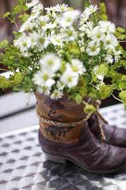 Cute Decorating Idea For Country Wedding Or Party Boots N Flowers Cowboy Boot Centerpieces Western Wedding Centerpieces Boot Centerpiece