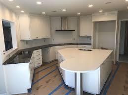 Calacatta Botanica Quartz Island With Silver Waves Granite Perimeter Fabricated And Installed By Affordable Granite Cabi Affordable Granite Cabinetry Granite
