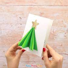 Use a ruler to measure halfway between the top and bottom of each tree shape. 3d Christmas Tree Card Video Video 3d Christmas Tree Card Christmas Tree Cards Christmas Crafts