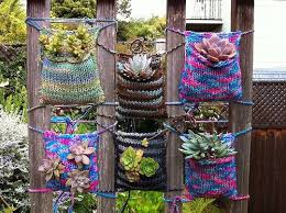 Join The Urban Knitting Movement And Brighten Your Neighborhood With Plant Pockets Offbeat Home Life Yarn Bombing Guerrilla Gardening Vertical Garden Diy
