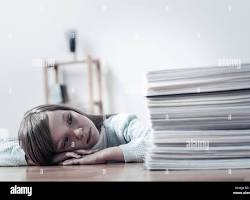 Image of stressedout parent looking at a pile of school bills