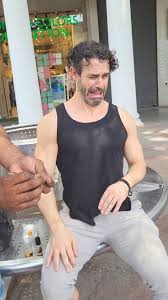 Street ear-cleaning in India. One of ...
