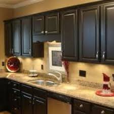 Black Cabinets And Tan Walls Black Kitchen Cabinets Black Kitchens Dark Kitchen Cabinets
