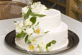 Fresh flowers on wedding cake. White Wedding Cake With Fresh Flowers On A Metal Tray Stock Photo Picture And Royalty Free Image Image 14623260