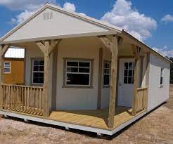 Derksen Portable Painted Deluxe Cabin With Porch Visit Www Derksenbuildingstx Com Portable House Shed To Tiny House Portable Cabins