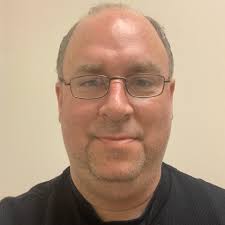 Why do insurance companies write off hail-damaged cars?