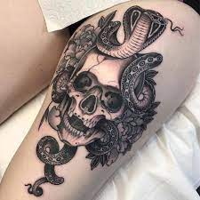 Tattoo Snob Snake Tattoo Design Skull Thigh Tattoos Skull And Snake Tattoo