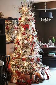 Flocked Christmas Tree With A Red And Gold Color Scheme Christmas Decorating Gold Christmas Decorations Christmas Colour Schemes Christmas Tree Decorations