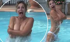 Elizabeth Hurley sizzles in topless swimming video... but fans question if  her son Damian filmed it | Daily Mail Online