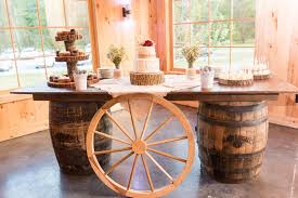 Barn Wedding Ideas Cake Table Ideas Wagon Wheels Whiskey Barrel Table Ideas Wedding Cake Ideas In 2020 Whiskey Barrel Table Barrel Table Wedding Cake Display
