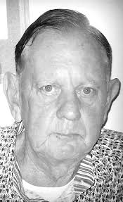 Newly elected commissioner Scotty Miley takes his seat