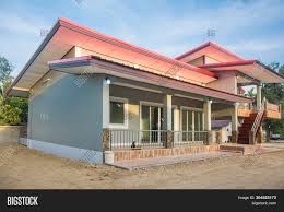 The house consists of 3 bedrooms all at the upper floor, with two toilet and bath, one with common anf the other is dedicated for the master'bedroom. New Modern Two Storey Image Photo Free Trial Bigstock