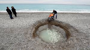 mystery sinkhole at nice beach (photo