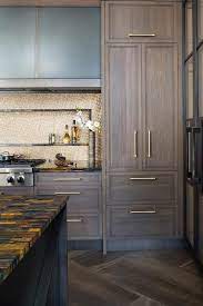 Enjoy free shipping on most stuff, even big stuff. Brown Oak Kitchen Cabinets Accented With Brass Pulls And A Gold And Black Marble Countertop Are Fit Oak Kitchen Cabinets Simple Kitchen Cabinets Kitchen Design