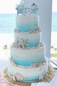 6 Summer Wedding Cakes We Love Beach Theme Wedding Cakes Themed Wedding Cakes Beach Wedding Cake