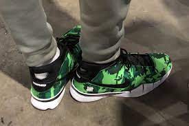 Giannis antetokounmpo deserves a signature sneaker in a bad basketball market. Giannis Antetokounmpo Spotted Sporting A Bright Green Undefeated X Nike Kobe 1 Protro Green Camo Sneakers Nike Zoom Kobe